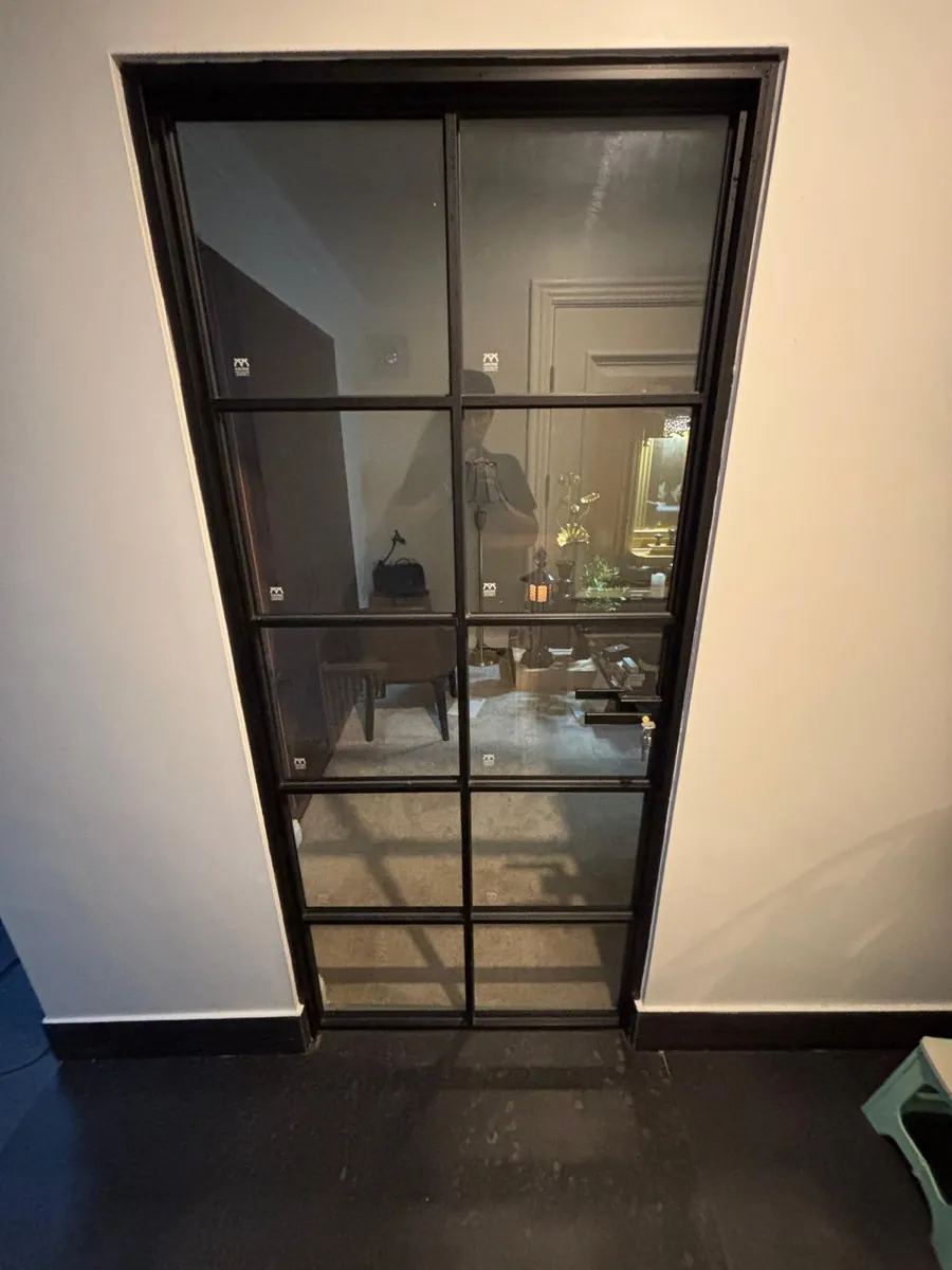 A black glazed internal door fitted in a Dublin home