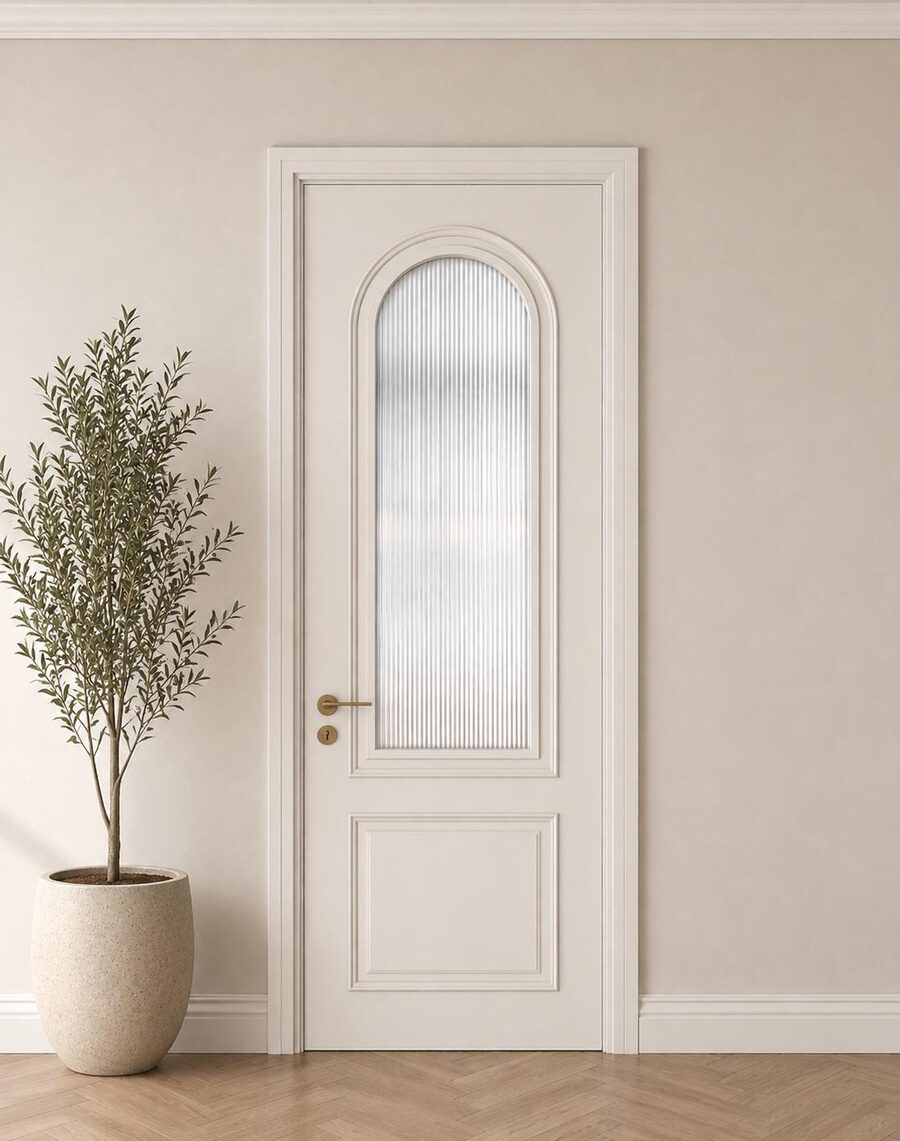 A white internal door with an arched glazed panel