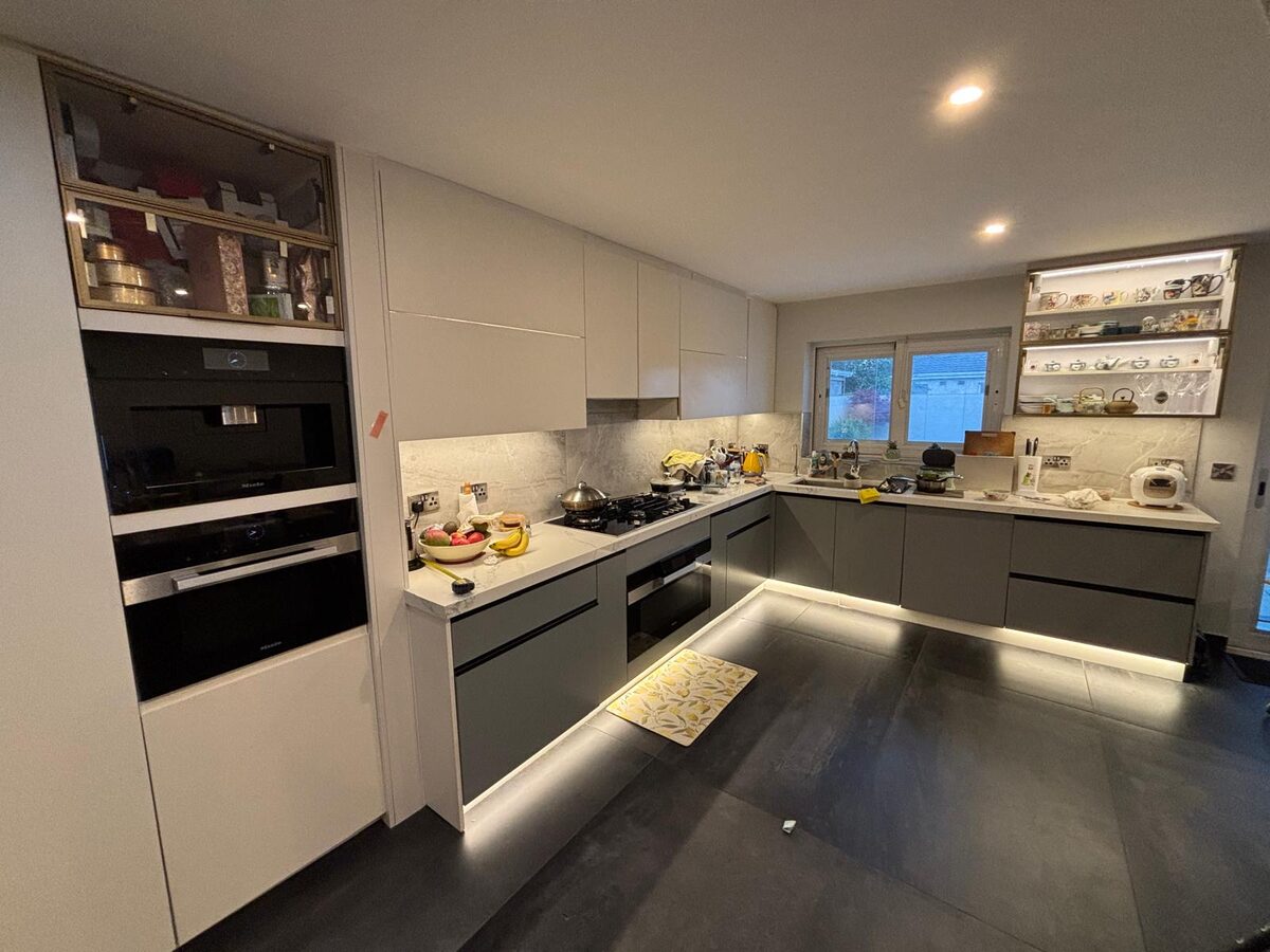Built in ovens and lit display cabinets in a kitchen we designed and fitted in Dublin