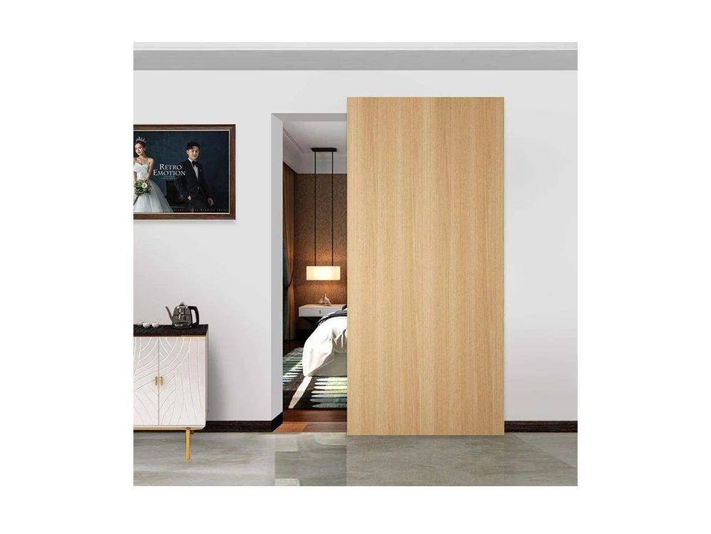 A timber pocket door slid open into the wall between two rooms