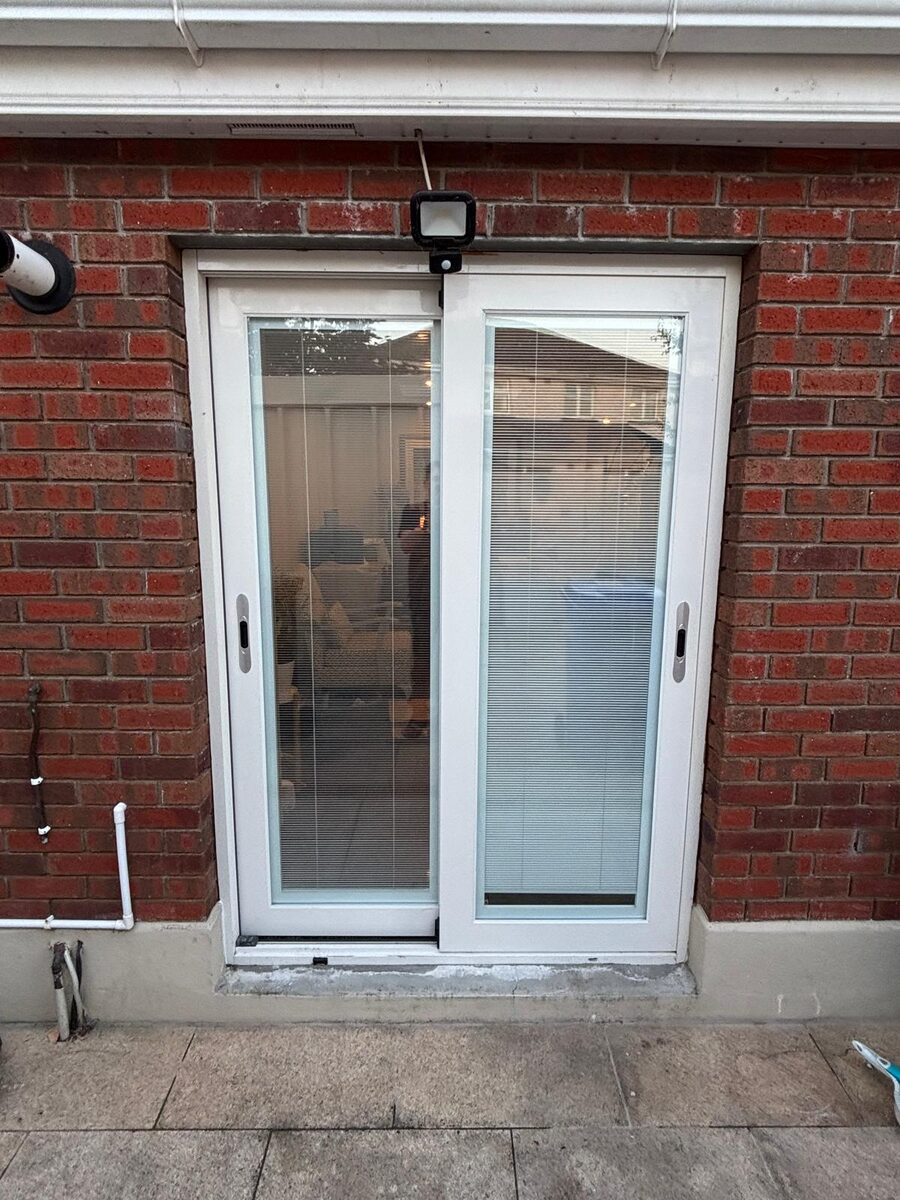 A new white patio door fitted in a red brick Dublin home